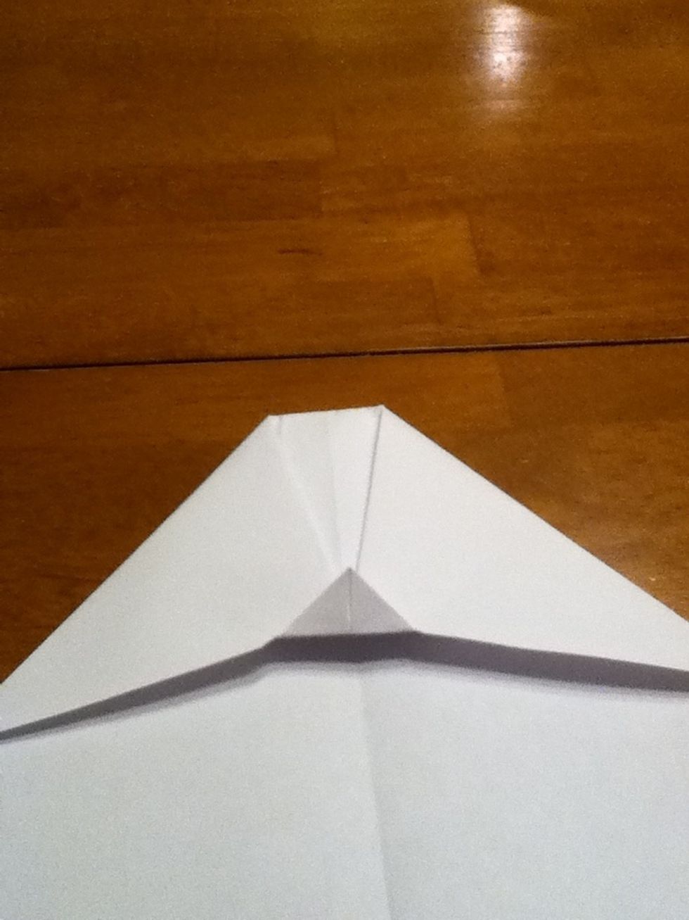 Fold the little triangle up.