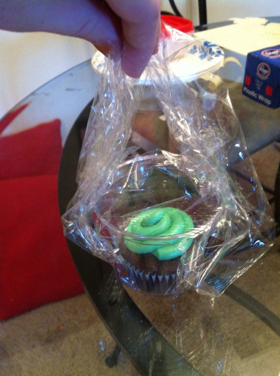 Fold the long ends up over the middle of the cup.