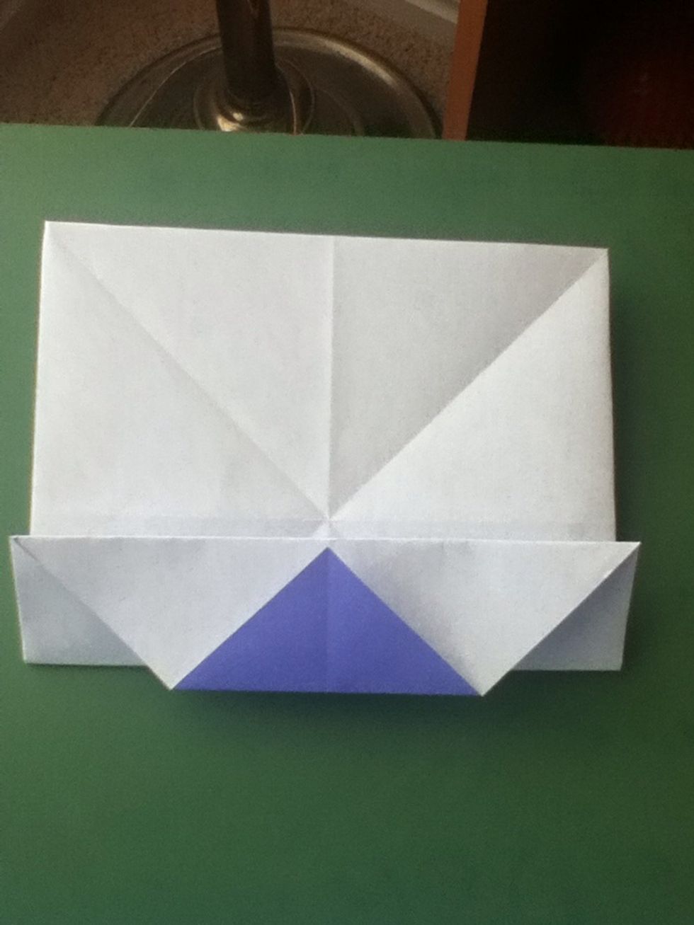 Fold the lower edge to the center; crease