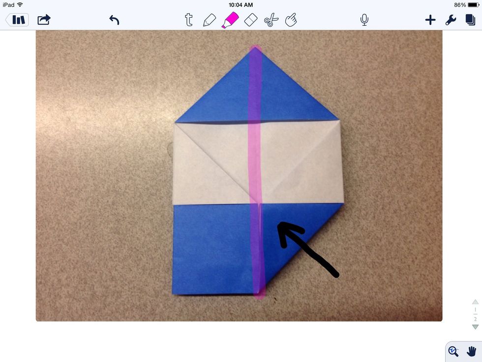 Fold the lower right hand corner to the center halfway line.