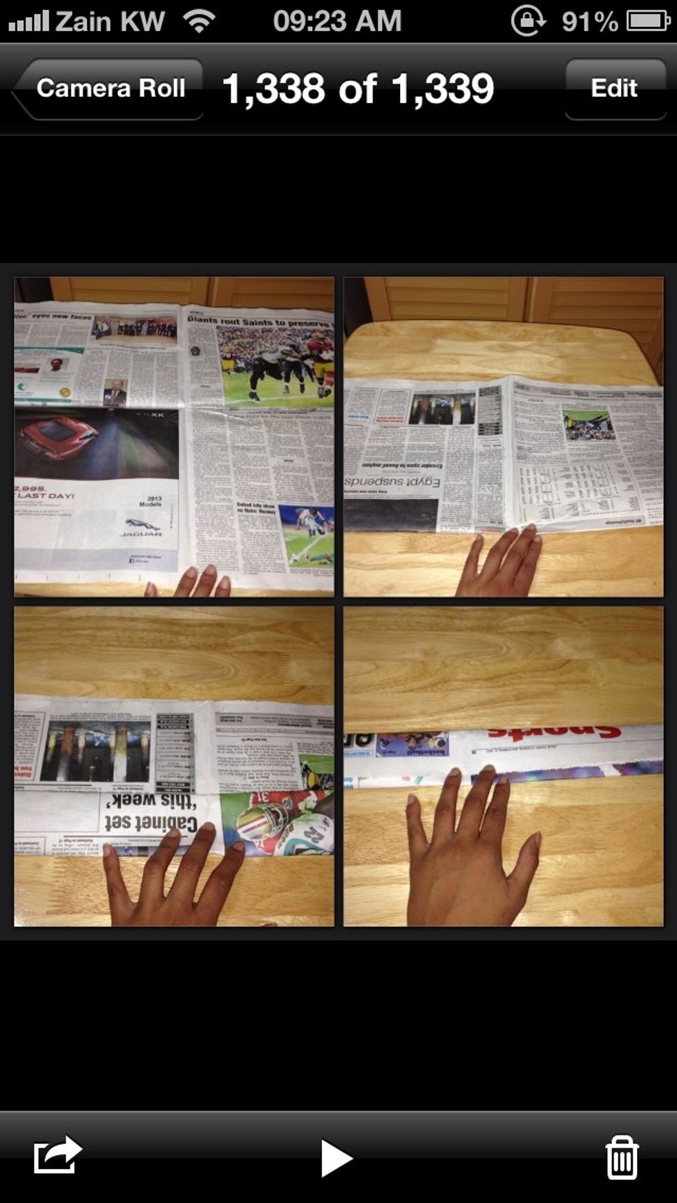 Fold the newspaper up, until it becomes like a ruler