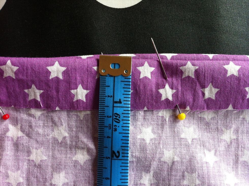 Fold the non-sewed side down approx. 1" put in needles