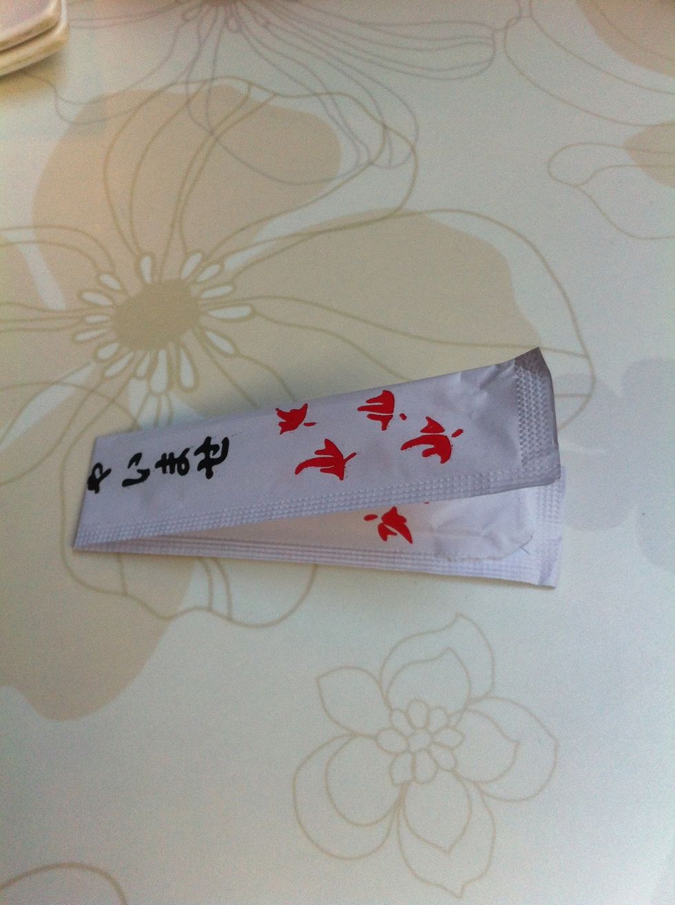 Fold the now empty wrapper in half.