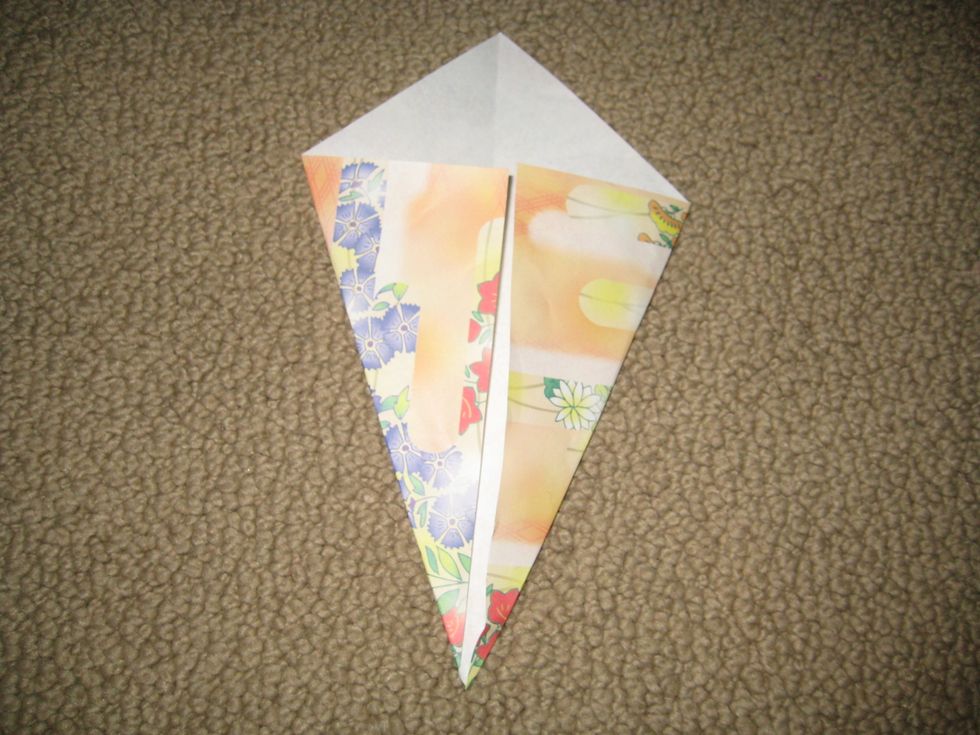 Fold the other side in. There should be a crack in the middle.