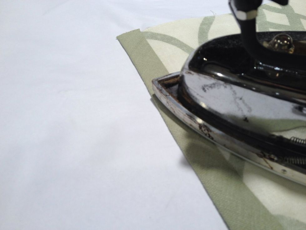 Fold the other side of the banding over and press. Continue applying the banding around the side, bottom and up the other side of the shade.