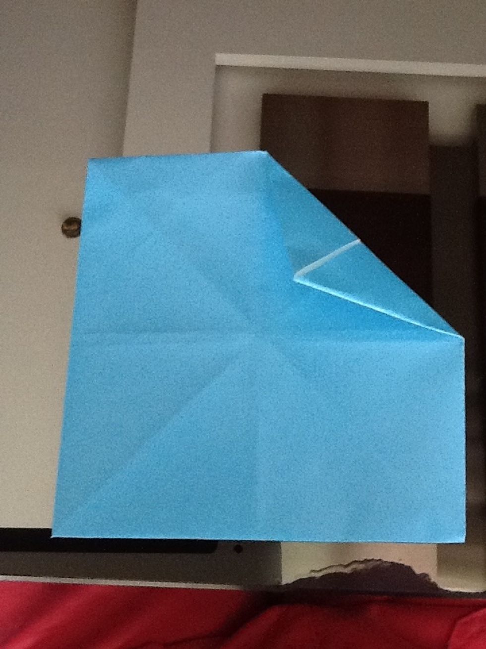 Fold the other side, the exact same thing you did on the other side. Do the same thing with the other triangles
