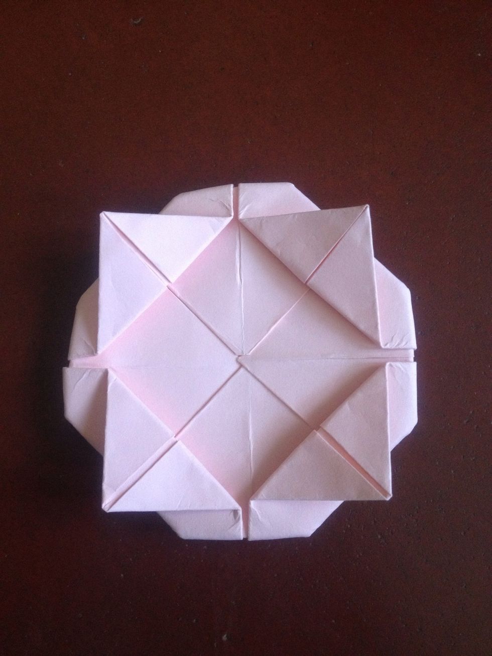 Fold the outer corners backward ..