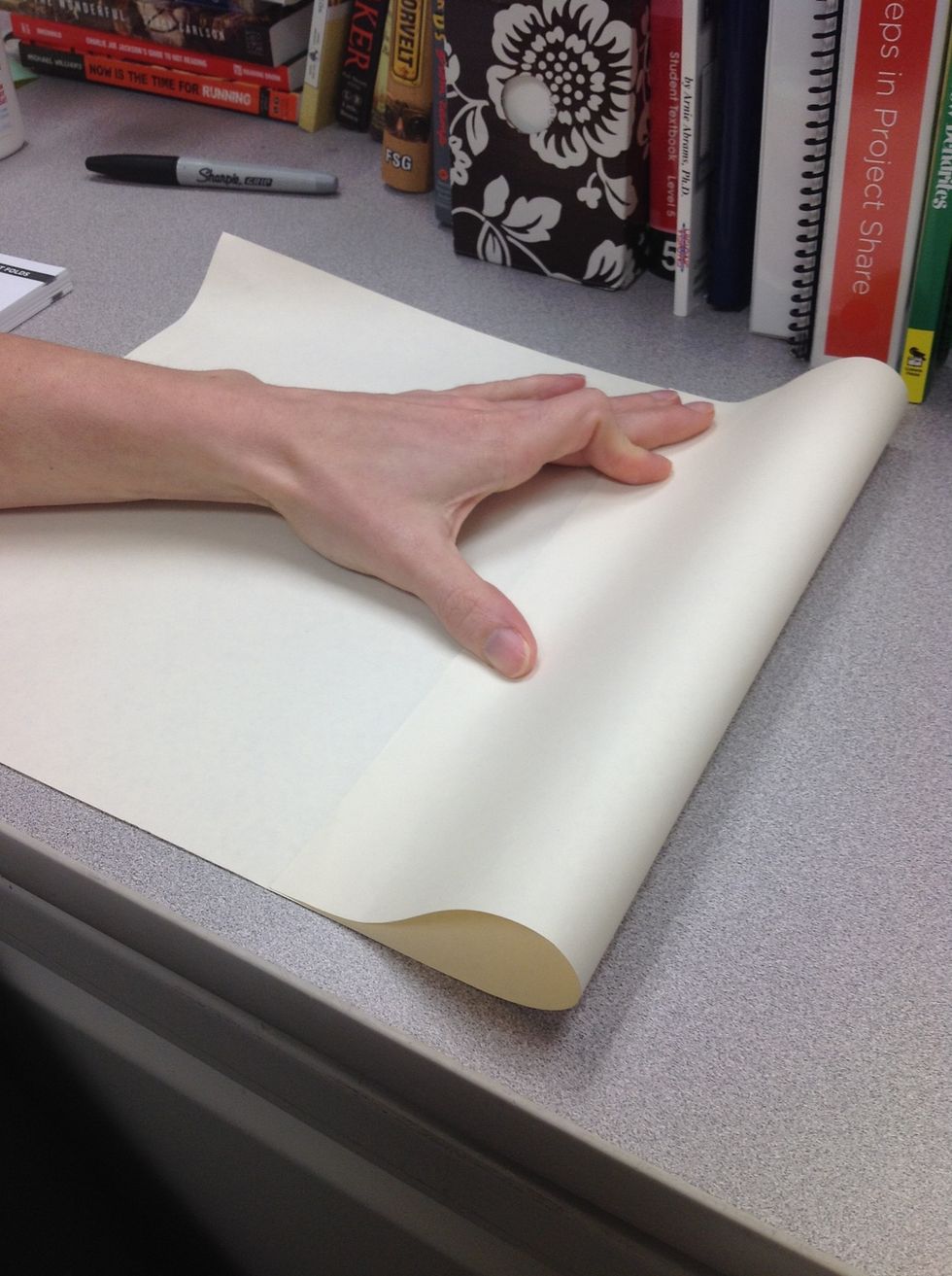 Fold the outer edge of the paper to the middle at the pinch.