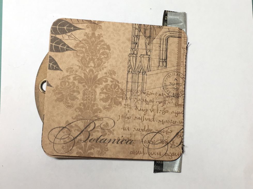 Fold the pages over the tag and cut away the excess washi tape.