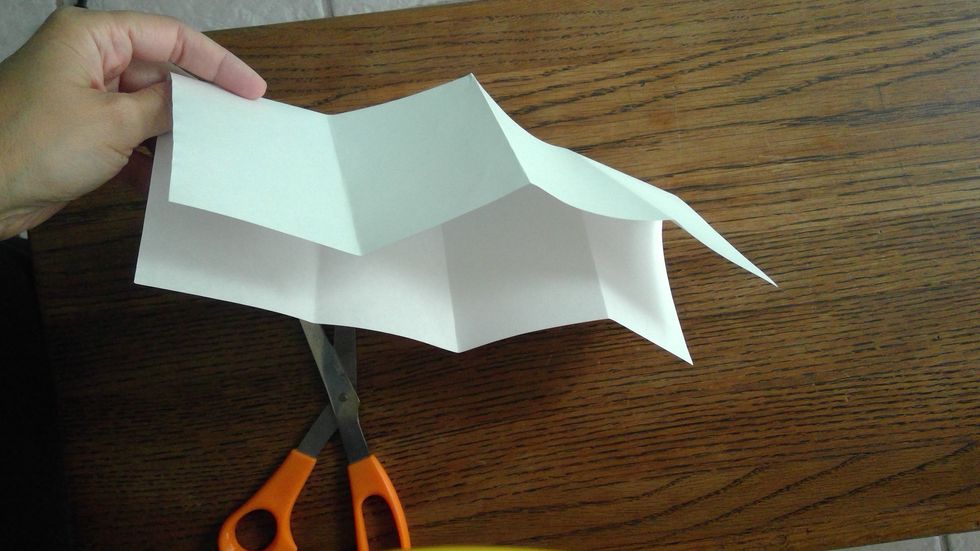 Fold the paper again, so it is long and skinny.