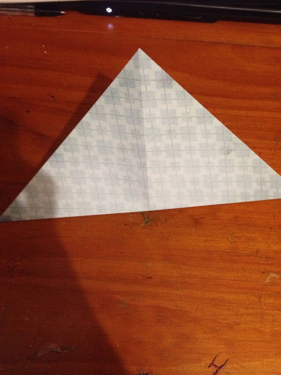 Fold the paper diagonally and crease well