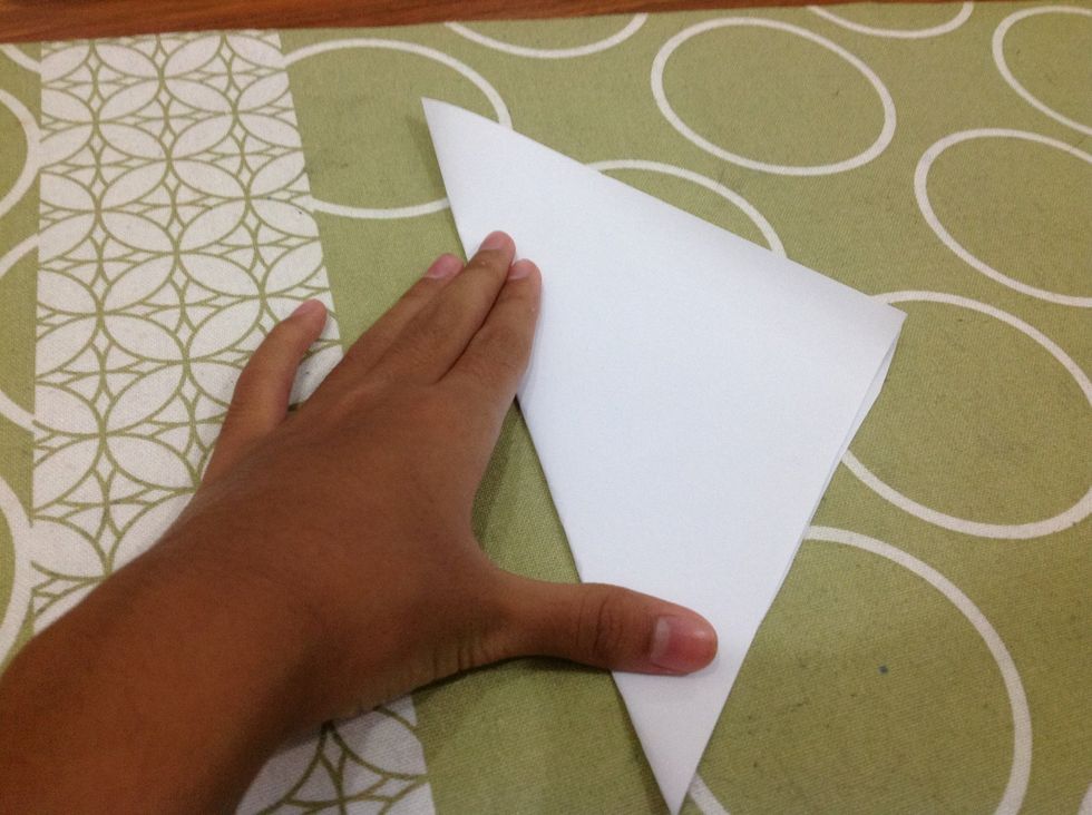 Fold the paper diagonally