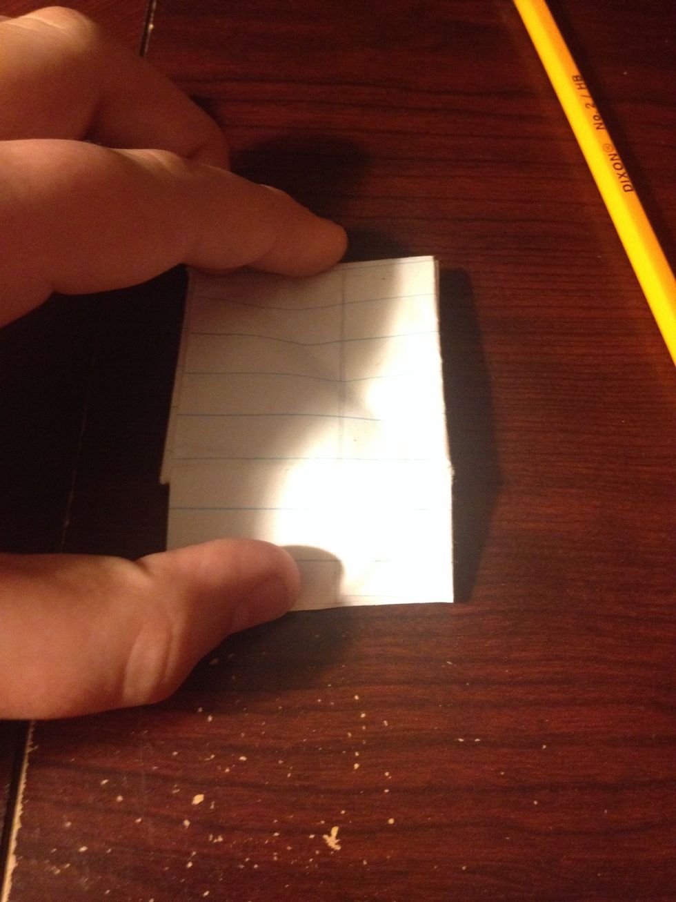 Fold the paper down at the line you made