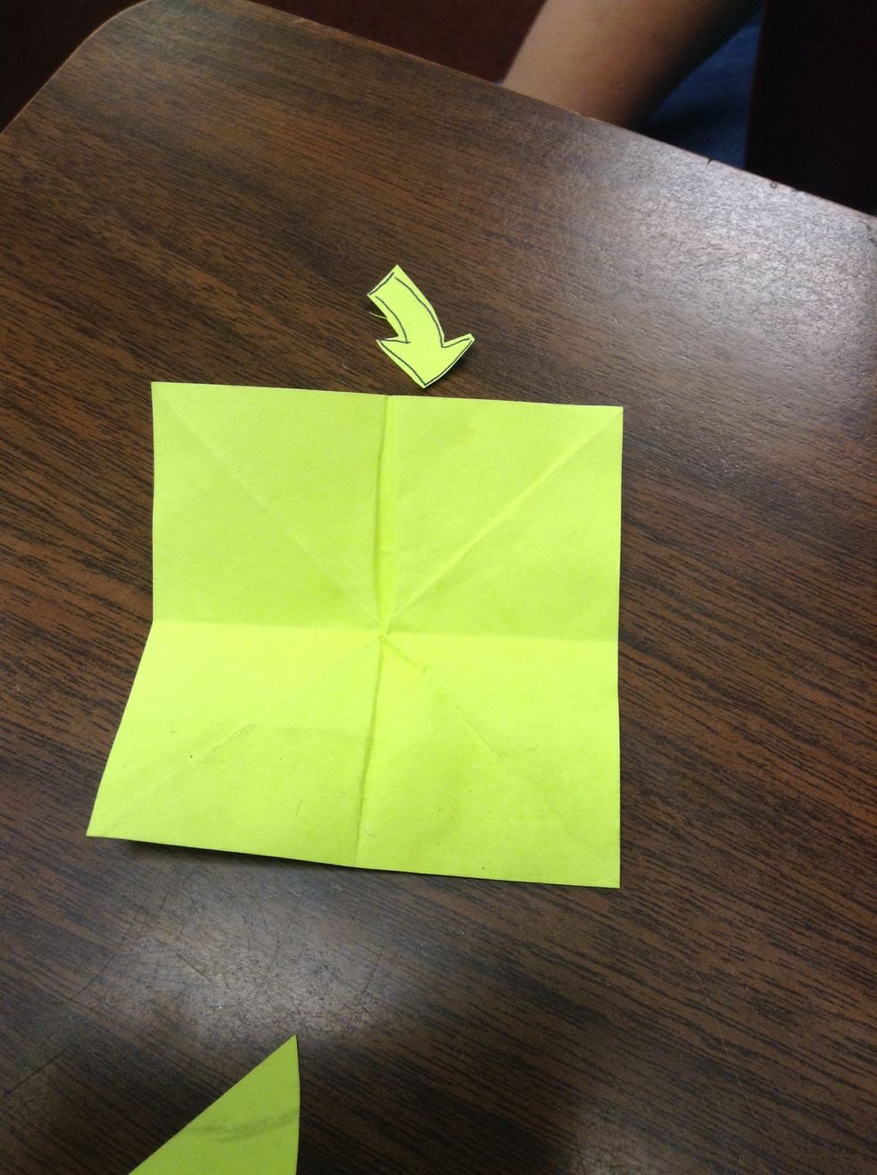 Fold the paper in half both ways and diagonal both ways.
