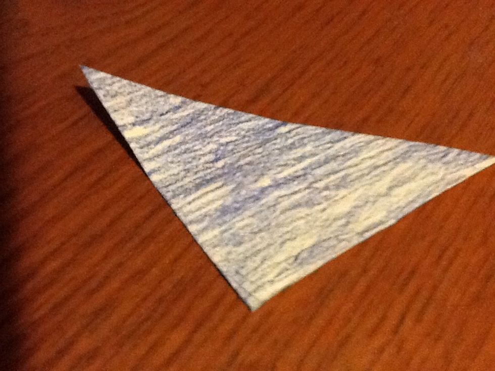 Fold the paper in half to result in a triangle,front facing in. (My back is dark blue.)