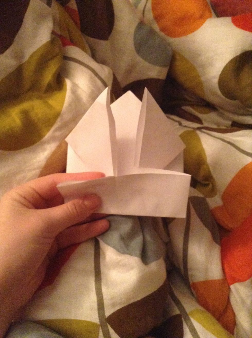 Fold the paper on the backside to be it's legs and make it jump