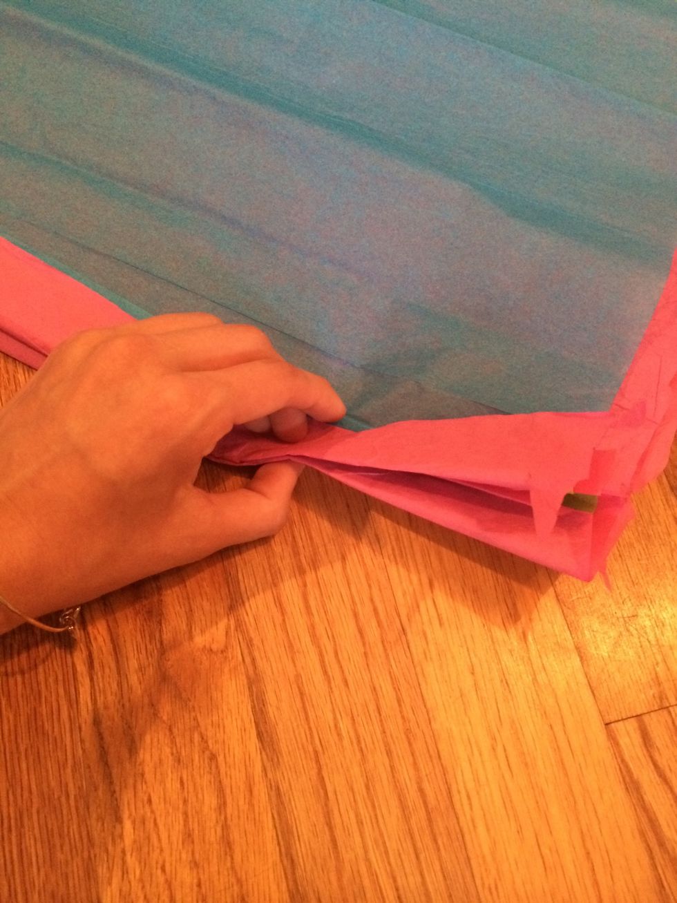 Fold the paper over and under like you are making a paper fan.