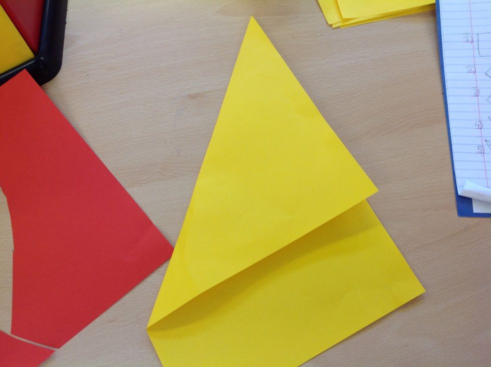 Fold the paper to make a square