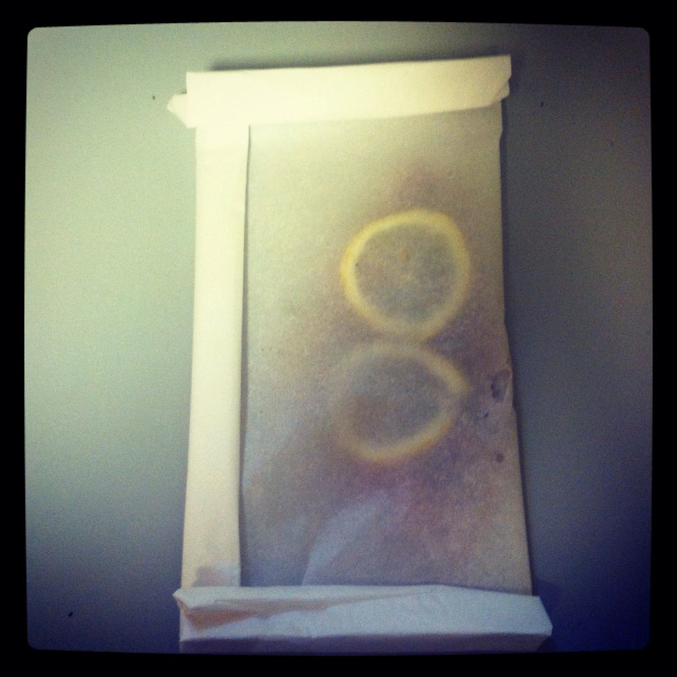 Fold the parchment paper up to make a little packet.