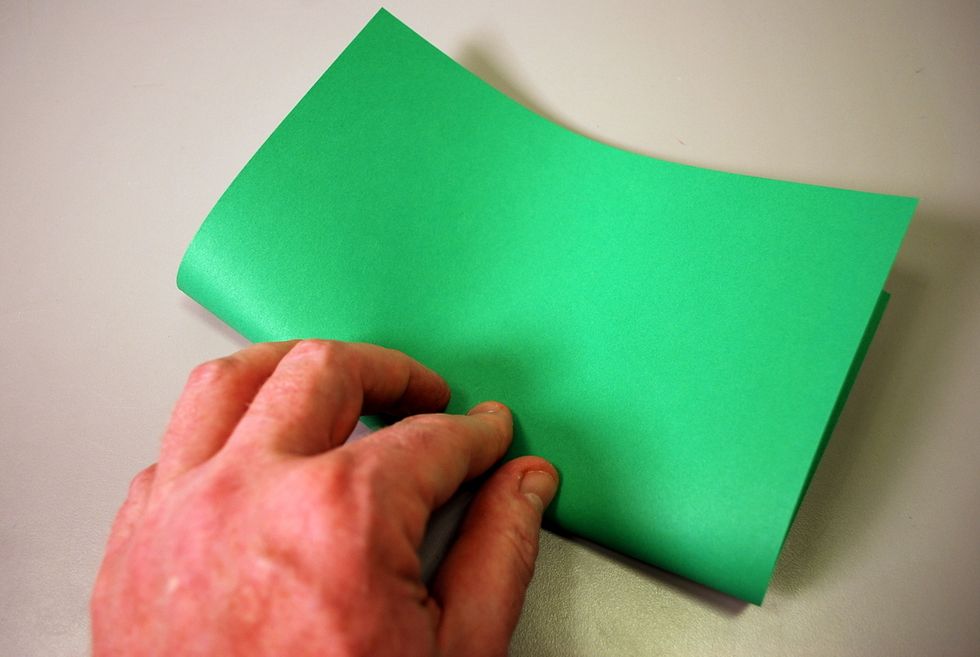 Fold the piece of cover stock in half - "hamburger" style.