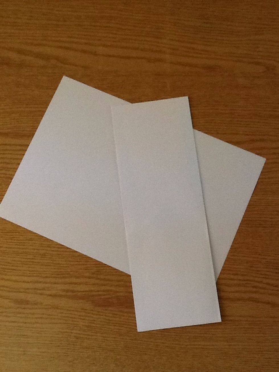 Fold the piece of paper into halves along its longest axis