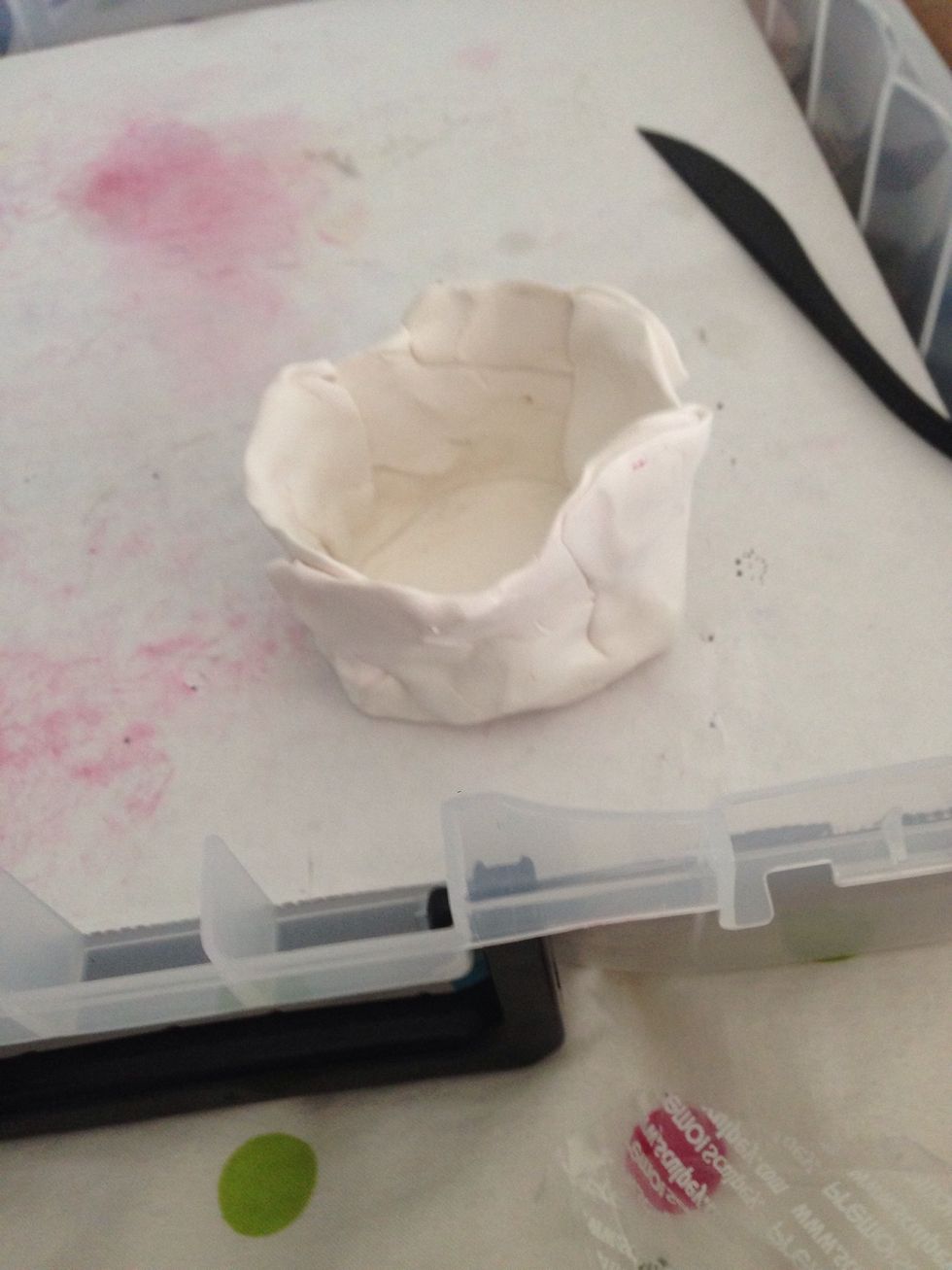 Fold the pieces of clay and smooth to create a smoother complexion.