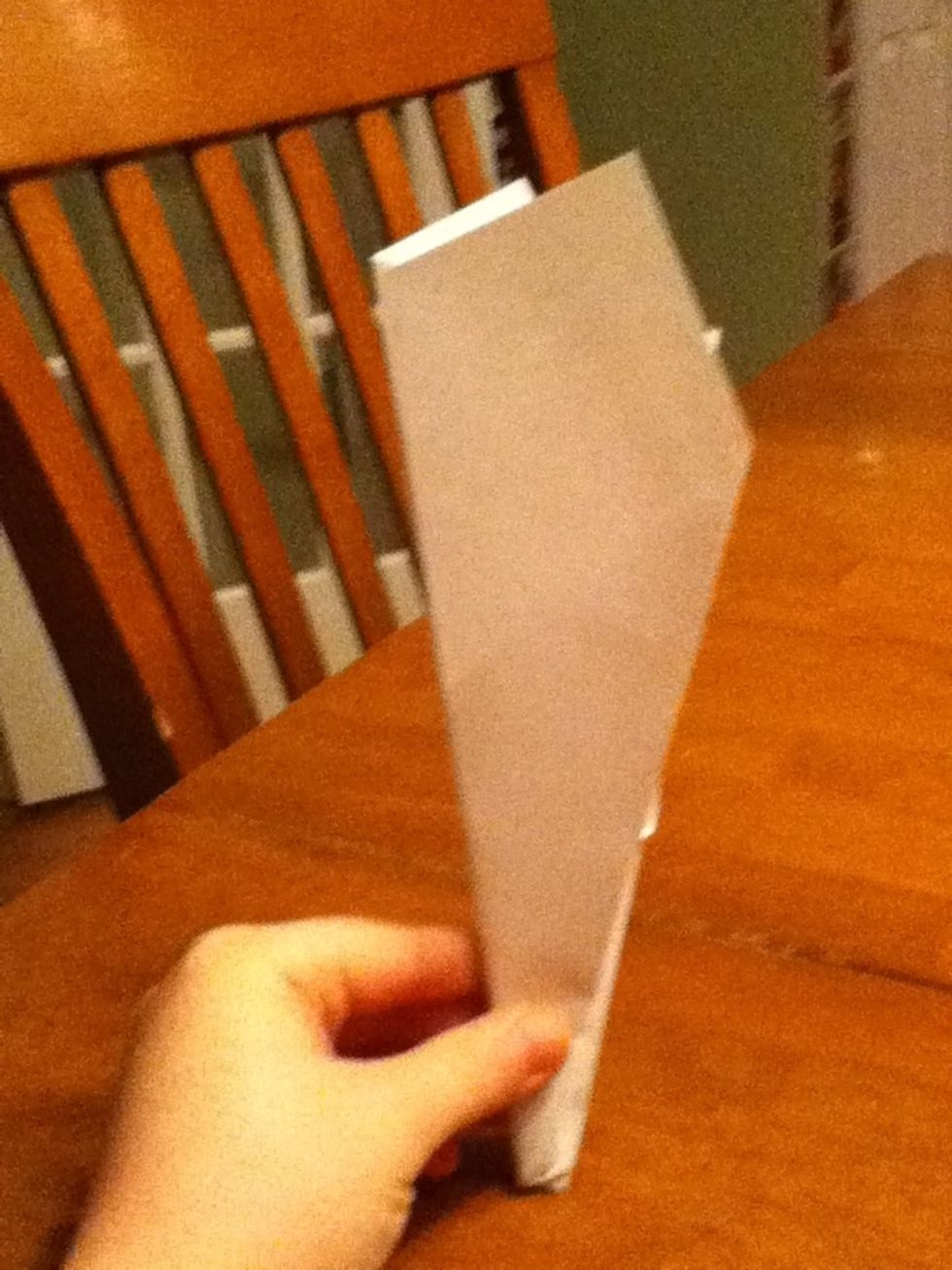 Fold the plane's wings down.