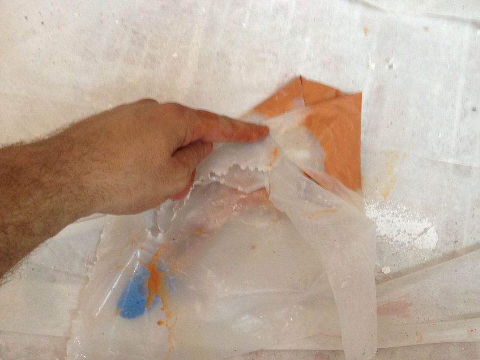 Fold the plastic over the brush.