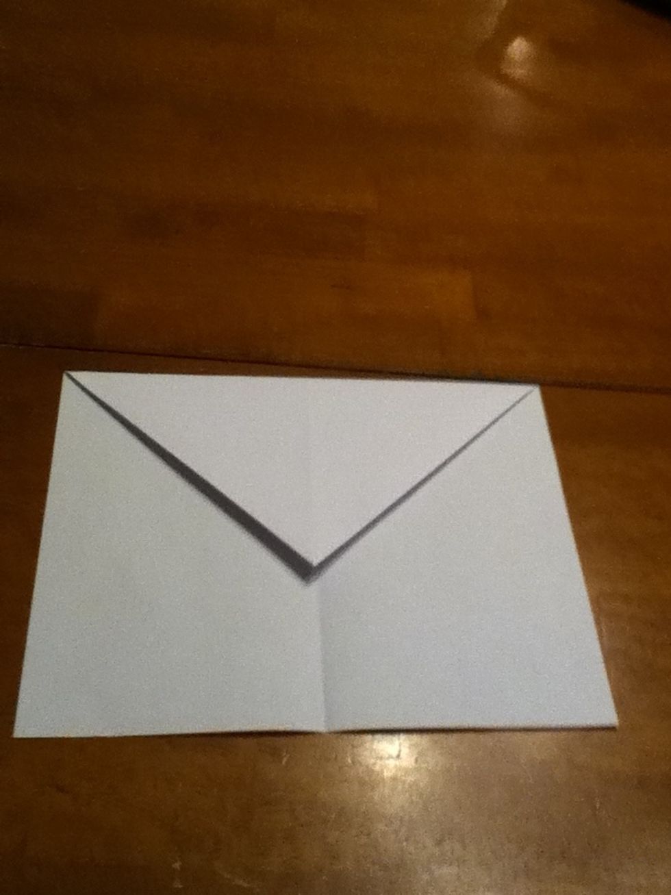Fold the point down so that you will have a square piece of paper.