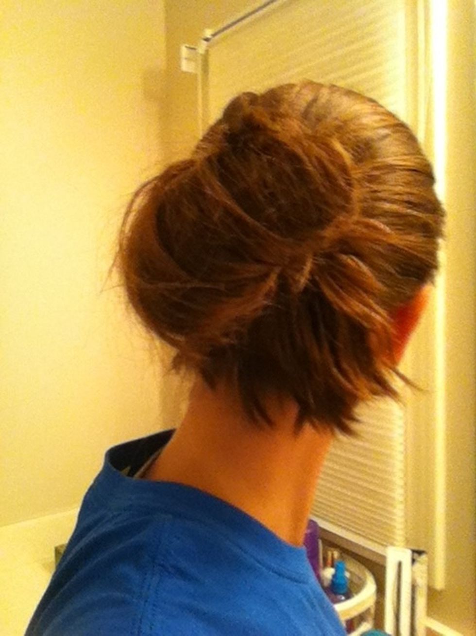 Fold the pony tail over into a bun