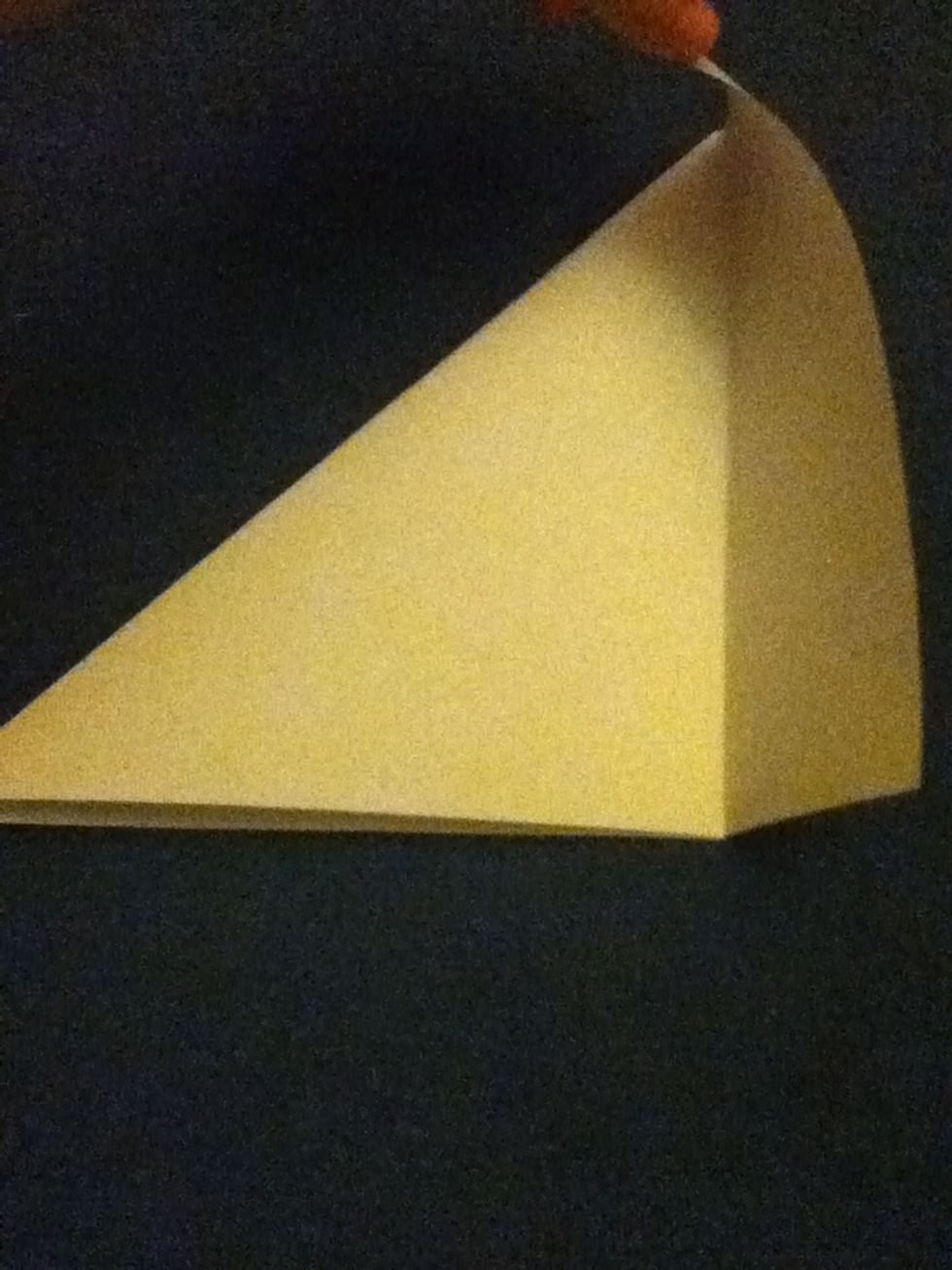 Fold the rectangle shaped piece of paper that's left over