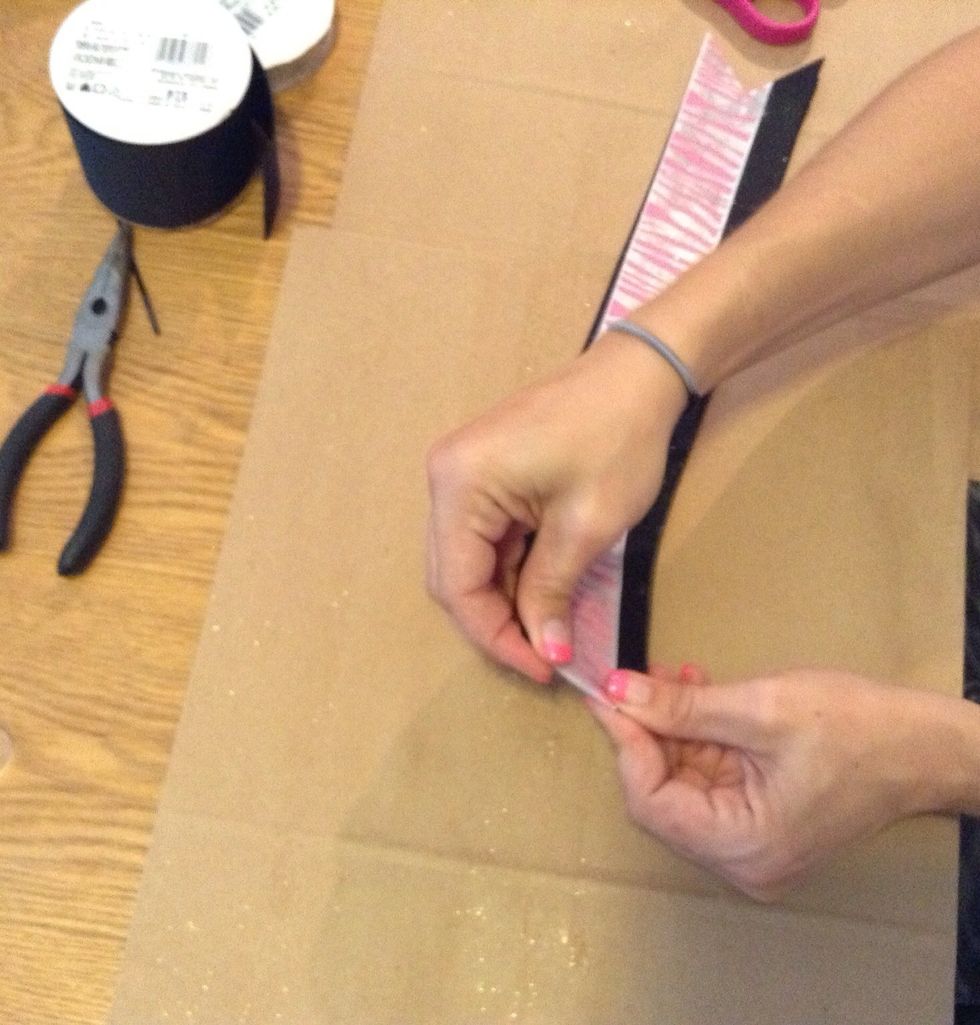 Fold the ribbon in half making a prominent crease in the middle of the ribbon.