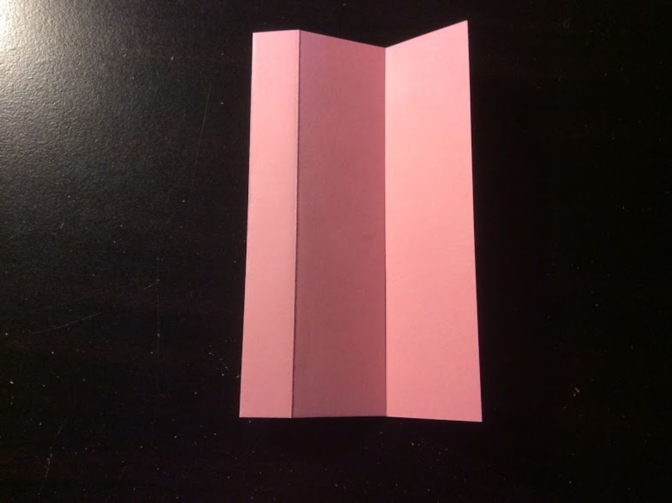 Fold the right edge to the third crease on the right side.