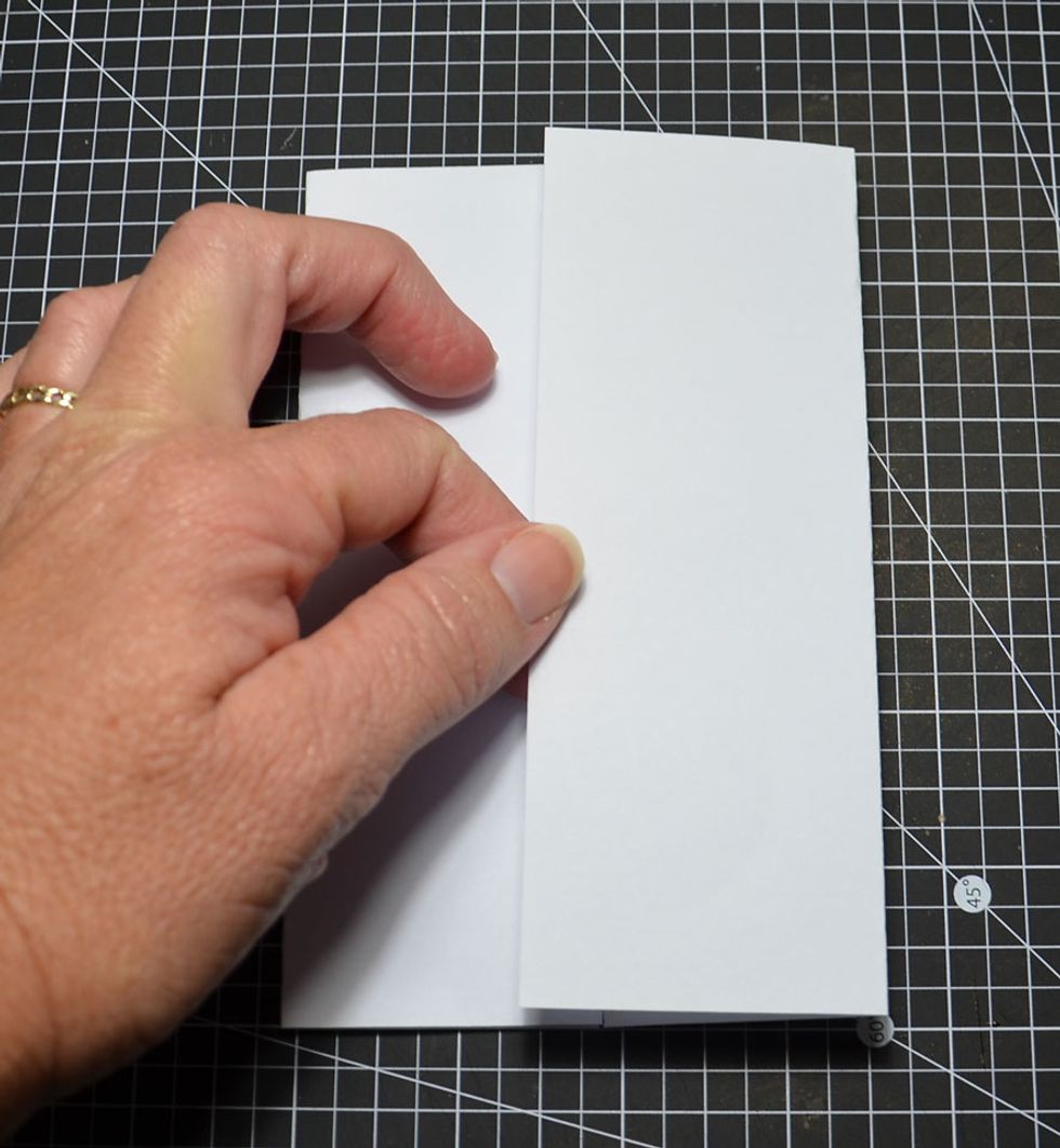 Fold the right side over but overlap the left side by about 1cm.