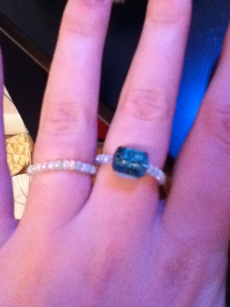 Fold the ring into a circle and tada! You have a ring! :)