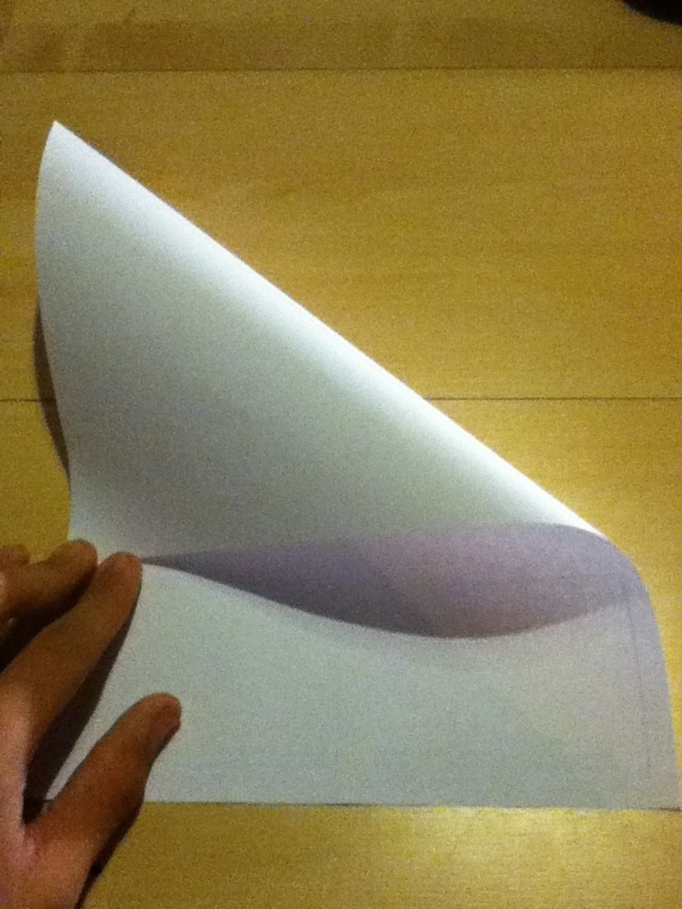Fold the sheet of paper into a square shape