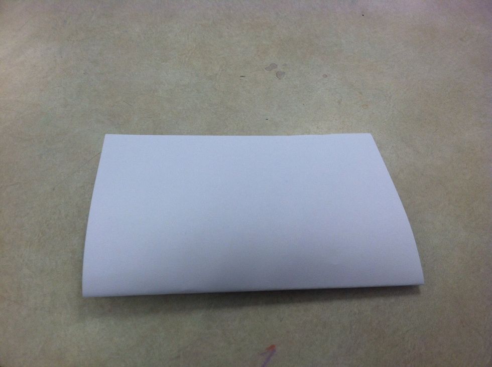 Fold the sheets of copy paper in half. (Hamburger fold)