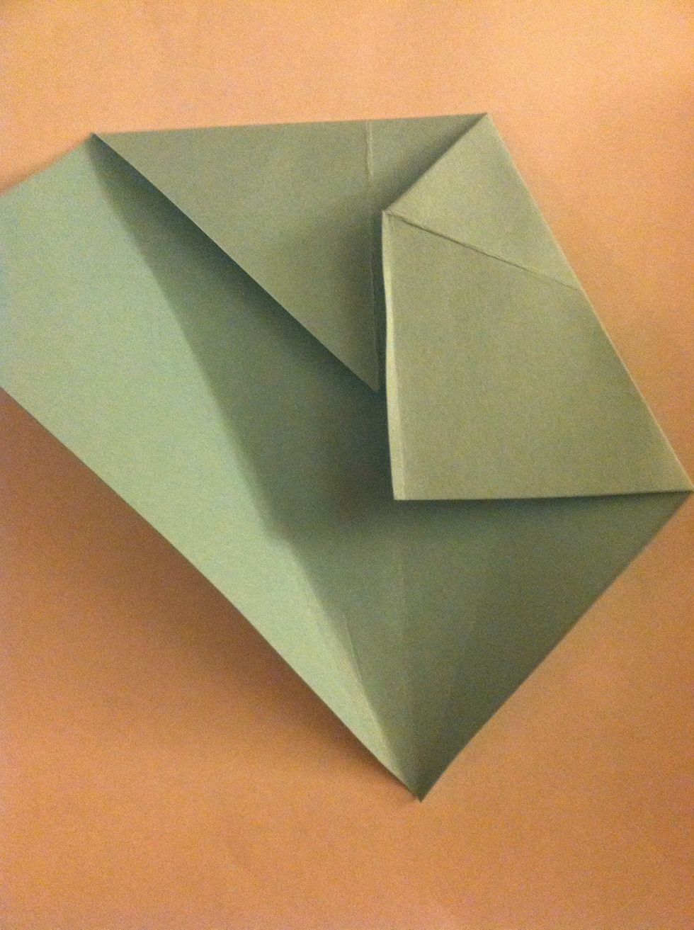 Fold the short side so it lines up with the crease.