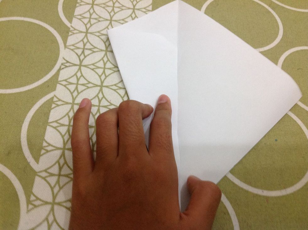 Fold the side to the middle, next to the line