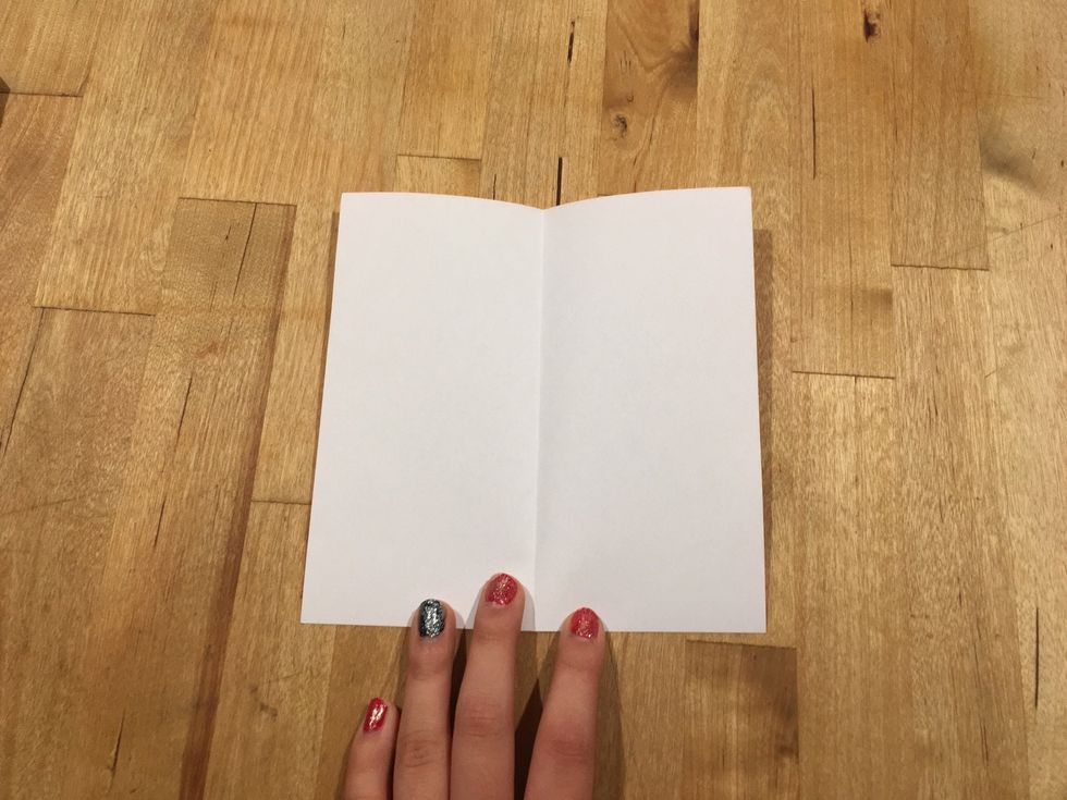 Fold the square in half twice so it has four lines in total