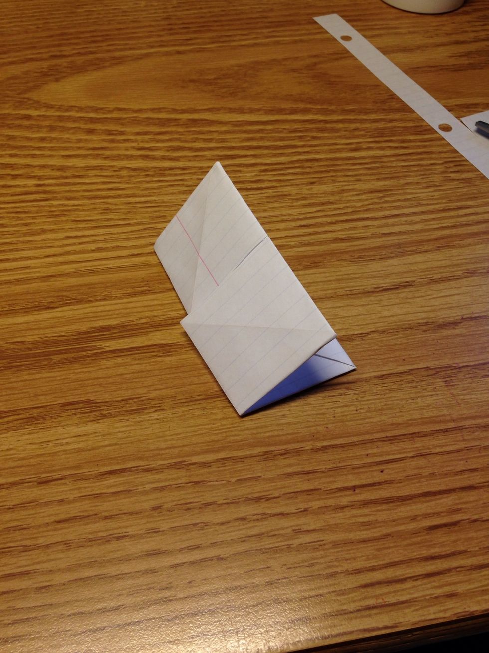 Fold the square in half. Unfold and fold in half the other way.