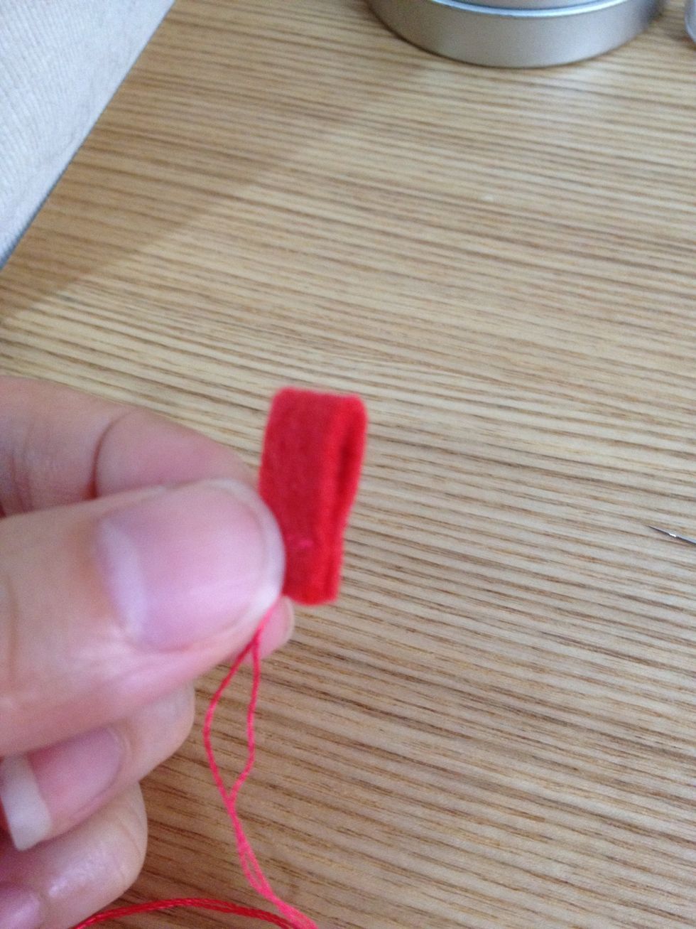 Fold the strap into half and sew! 3 running stitches would be good enough!