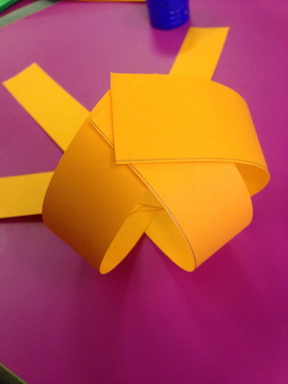 Fold the strips up and glue them together.
