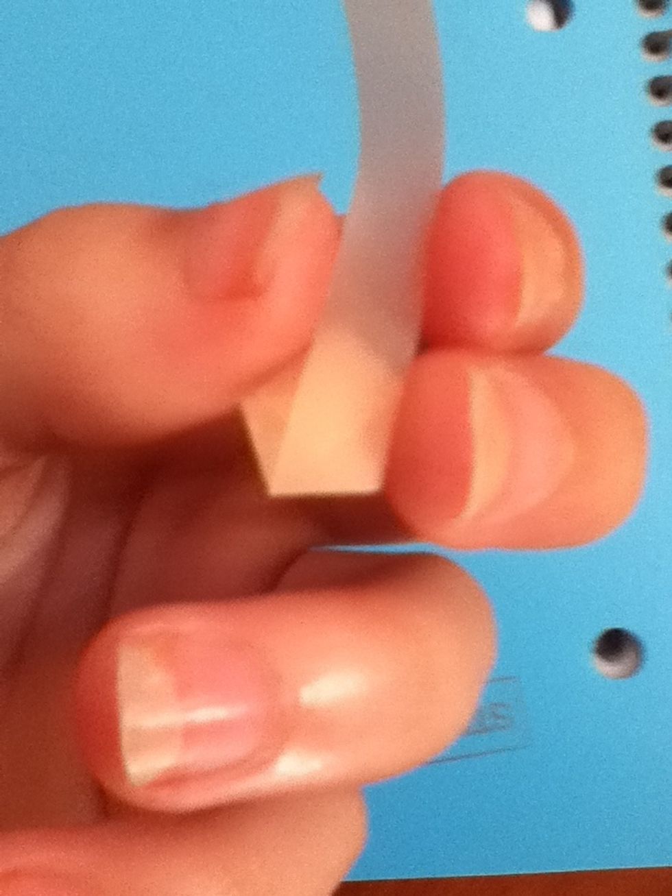 Fold the tail up to the right. Make sure you folds are crisp and taut.