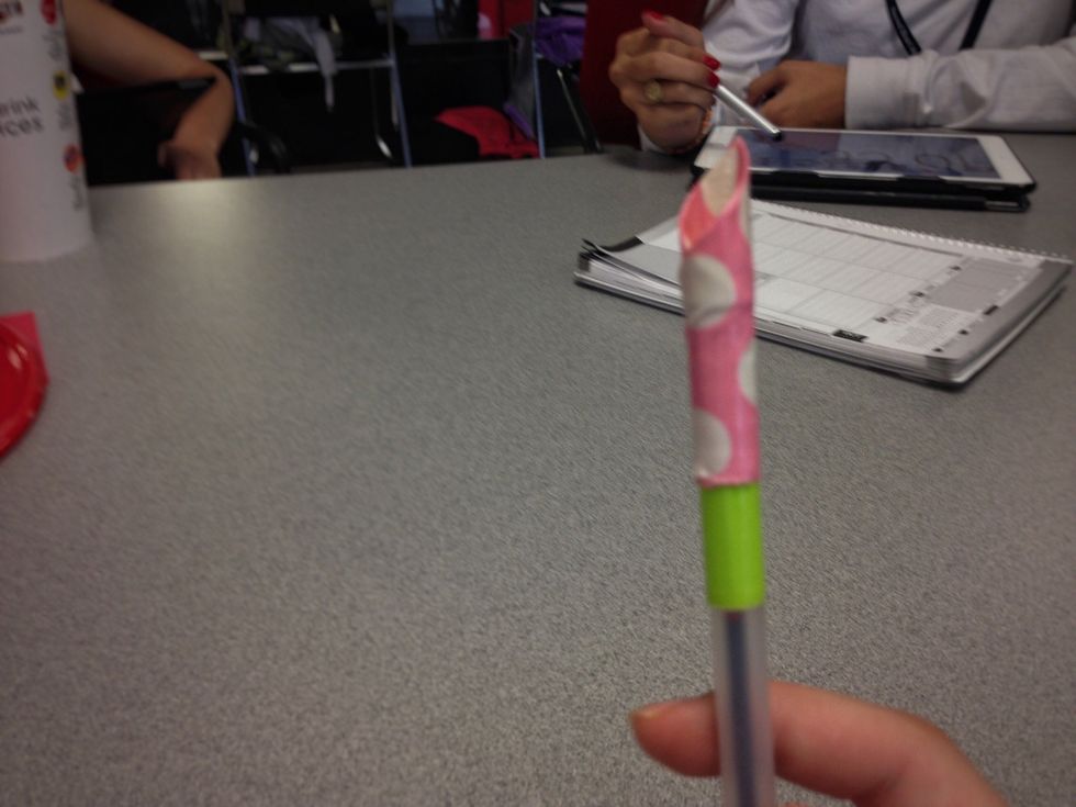 Fold the tape around the pen so that it sticks and you will have your first petal!