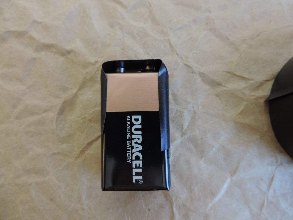 Fold the tape down the sides of the battery. This helps keep the tape secure.