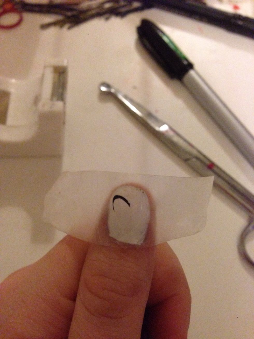 Fold the tape out and put it on your nail
