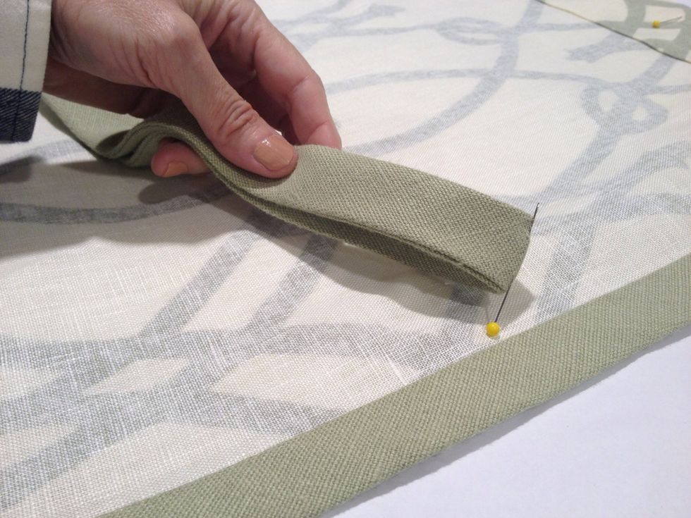 Fold the ties in half vertically and mark the center