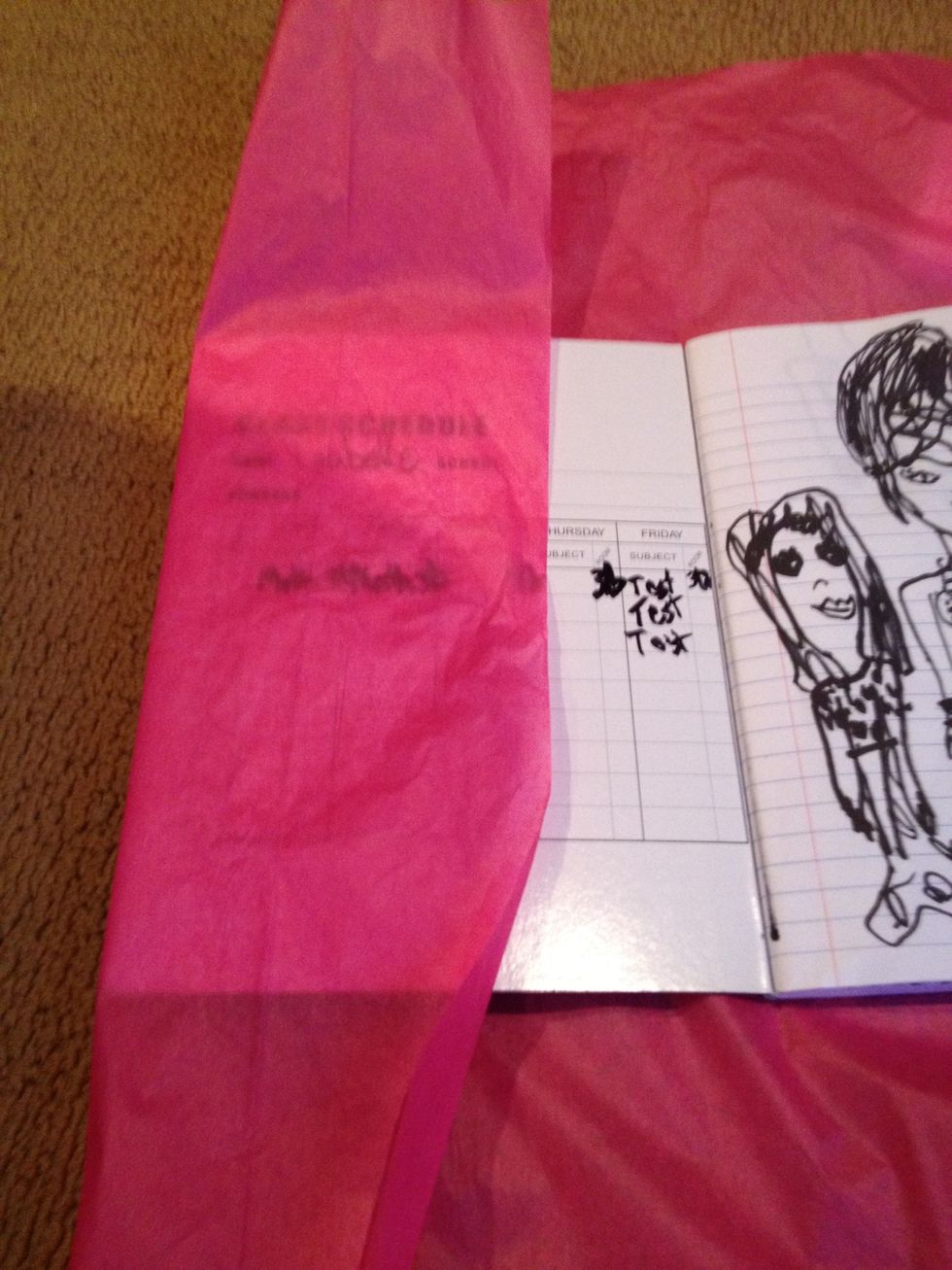 Fold the tissue paper on the inside front cover like this.Repeat on the back cover.