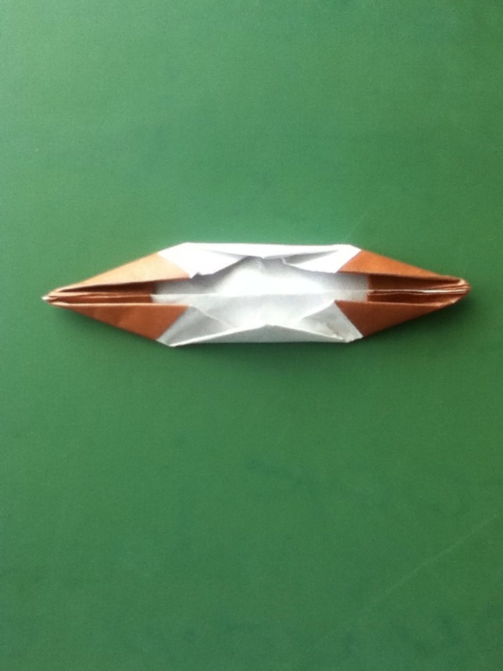 Fold the top and bottom corners in to the center; the layers are thick so fold carefully and accurately